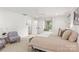 Bright primary bedroom with ensuite, white trim, and neutral decor at 401 Woodland St, Davidson, NC 28036