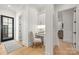 Hallway with a built-in desk nook, a chair, and a modern, minimalist aesthetic creating a functional workspace at 401 Woodland St, Davidson, NC 28036