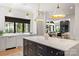 Modern kitchen with a large island, white countertops, and stylish lighting at 401 Woodland St, Davidson, NC 28036