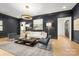 Elegant living room with dark walls, light wood floors, and sophisticated decor at 401 Woodland St, Davidson, NC 28036