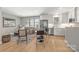 This living room and kitchen combo features stainless steel appliances, and an open floor plan at 401 Woodland St, Davidson, NC 28036