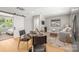 The living room features modern decor, and is steps away from the bedrooom with a sliding barn door at 401 Woodland St, Davidson, NC 28036