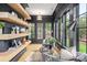 Bright sitting area with natural light, custom shelves, and comfortable seating at 401 Woodland St, Davidson, NC 28036