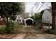 Exterior view of a detached one-car garage with a fenced-in backyard and mature trees at 402 Pickens Ct, Rock Hill, SC 29730