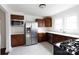 Well-lit kitchen featuring stainless steel appliances, quartz countertops, and ample wood cabinetry at 402 Pickens Ct, Rock Hill, SC 29730