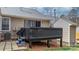 Back deck features slider access to the home, and is complimented by a walkway at 413 19Th Avenue Ne Ct, Hickory, NC 28601