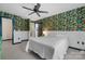 Bedroom featuring floral wallpaper, white trim, and a bed, with an open doorway to another room at 413 19Th Avenue Ne Ct, Hickory, NC 28601