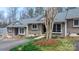 Charming home featuring a well-manicured lawn, mature trees, and classic design at 413 19Th Avenue Ne Ct, Hickory, NC 28601