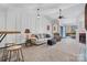 Spacious living area includes a bar and seating, comfortable sofa and chair, and access to the deck at 413 19Th Avenue Ne Ct, Hickory, NC 28601