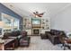 Inviting living room featuring a stone fireplace, built-in shelves, and ample seating at 4130 Brownwood Nw Ln, Concord, NC 28027