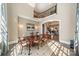 Sunlit dining room with a wooden table and chairs, a patterned rug, and an arched doorway at 492 Agnew Rd, Mooresville, NC 28117