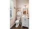 Well-lit bathroom with a modern vanity, decorative shelving, and stylish fixtures at 5601 Underwood Ave, Charlotte, NC 28213