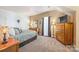 Comfortable bedroom with neutral tones, plush carpeting, and ample natural light at 5601 Underwood Ave, Charlotte, NC 28213