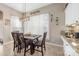 Cozy dining area featuring a wooden table, stylish lighting, and decorative wall accents at 5601 Underwood Ave, Charlotte, NC 28213