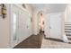 Elegant foyer with hardwood floors, a view of the staircase, and stylish interior doors at 5601 Underwood Ave, Charlotte, NC 28213