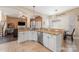 Open kitchen showcasing granite counters, white cabinetry, and a seamless flow to the adjacent living area at 5601 Underwood Ave, Charlotte, NC 28213