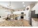 Well-lit kitchen with stainless steel appliances, granite countertops, and ample cabinet space at 5601 Underwood Ave, Charlotte, NC 28213