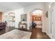 Open-concept living space with hardwood floors, arched doorways, and tasteful decor at 5601 Underwood Ave, Charlotte, NC 28213