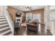 Cozy living room featuring a fireplace, hardwood floors, and comfortable seating at 5601 Underwood Ave, Charlotte, NC 28213