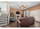 Comfortable living room with a fireplace and a large leather sofa provides a relaxing space to unwind at 5601 Underwood Ave, Charlotte, NC 28213