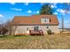 Exterior view of the home, including a back deck area and a well maintained lawn at 655 Mock Mill Rd, Statesville, NC 28677
