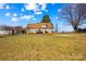 The backyard of the property is vast, with a clear view of the house and the back deck at 655 Mock Mill Rd, Statesville, NC 28677