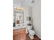 Clean bathroom features a single sink vanity and a standard toilet at 655 Mock Mill Rd, Statesville, NC 28677