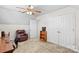 Spacious carpeted bedroom provides a seating area, closet, and office space at 655 Mock Mill Rd, Statesville, NC 28677