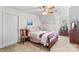 Cozy bedroom featuring a ceiling fan and a window allowing natural light to illuminate the space at 655 Mock Mill Rd, Statesville, NC 28677