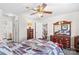 Spacious bedroom with ceiling fan, carpeting, closet, and view to en suite bathroom at 655 Mock Mill Rd, Statesville, NC 28677
