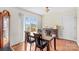 Well-lit dining room featuring hardwood floors and a sliding glass door leading to an outdoor space at 655 Mock Mill Rd, Statesville, NC 28677