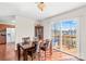 Bright dining room with sliding doors to the outdoor deck and an adjacent kitchen at 655 Mock Mill Rd, Statesville, NC 28677