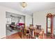 Elegant dining room with hardwood floors, a large wooden table, and easy access to the living room at 655 Mock Mill Rd, Statesville, NC 28677