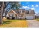 Inviting single-Gathering home with a well-manicured lawn and charming curb appeal on a sunny day at 655 Mock Mill Rd, Statesville, NC 28677