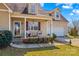 Charming front porch with seating, red shutters, and attractive landscaping, perfect for relaxing outdoors at 655 Mock Mill Rd, Statesville, NC 28677