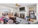 Spacious living room with a fireplace and an open floor plan leading to the dining area at 655 Mock Mill Rd, Statesville, NC 28677