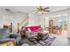 Bright living room featuring a staircase, neutral walls, and an open layout to the adjacent dining area at 655 Mock Mill Rd, Statesville, NC 28677