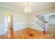 Elegant dining room with hardwood floors, crown molding, and a chandelier; perfect for entertaining guests at 6916 Sardis Green Ct, Charlotte, NC 28270