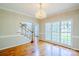 Elegant dining room with hardwood floors, crown molding, and a chandelier; perfect for entertaining guests at 6916 Sardis Green Ct, Charlotte, NC 28270