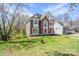 Traditional brick and siding home with manicured lawn and mature trees in a residential neighborhood at 6916 Sardis Green Ct, Charlotte, NC 28270