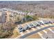 Community aerial shot displaying pond, trees, and new homes in this beautiful neighborhood at 7056 Cornwallis Ct, Iron Station, NC 28080