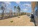Backyard with a pond view, featuring patio with outdoor dining and grilling spaces for outdoor enjoyment at 7056 Cornwallis Ct, Iron Station, NC 28080