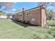 Well-maintained brick home boasting a level yard, landscaping, and convenient basement access at 737 Waverly Pl, Statesville, NC 28677