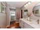 Well-lit bathroom featuring double vanity, modern fixtures, and a shower-tub combo at 737 Waverly Pl, Statesville, NC 28677