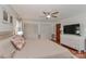 Relaxing bedroom with hardwood floors, ceiling fan, and a closet for storage at 737 Waverly Pl, Statesville, NC 28677