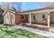 Inviting brick front porch with rocking chairs and a lovely garden, perfect for relaxing at 737 Waverly Pl, Statesville, NC 28677