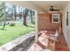 Inviting brick front porch with rocking chairs and a lovely garden, perfect for relaxing at 737 Waverly Pl, Statesville, NC 28677