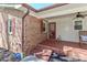 Inviting brick front porch with rocking chairs and a lovely garden, perfect for relaxing at 737 Waverly Pl, Statesville, NC 28677
