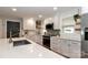 Modern kitchen features quartz countertops, white cabinets, stainless appliances, and tile backsplash at 737 Waverly Pl, Statesville, NC 28677