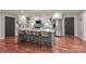 Spacious kitchen features quartz countertops, stainless appliances, white cabinets, and island seating at 737 Waverly Pl, Statesville, NC 28677
